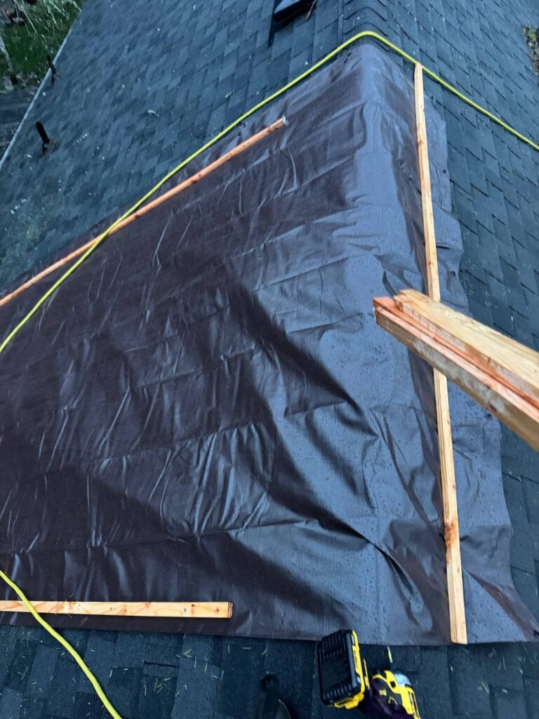 Emergency tarping on roof after tree damage in Portland
